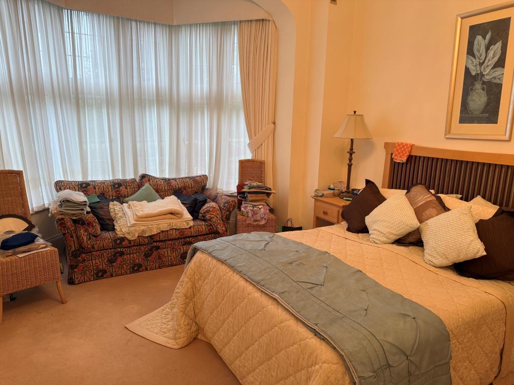 Lot: 127 - GROUND FLOOR FLAT WITH GARDENS AND PARKING IN FAVOURED MEADS LOCATION - Main bedroom with window overlooking gardens